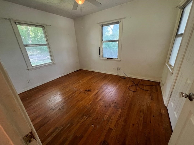 143 Brookshire Ave, Azle, TX 76020 - unfurnished room featuring hardwood / wood-style floors, healthy amount of natural light, ceiling fan, and baseboards