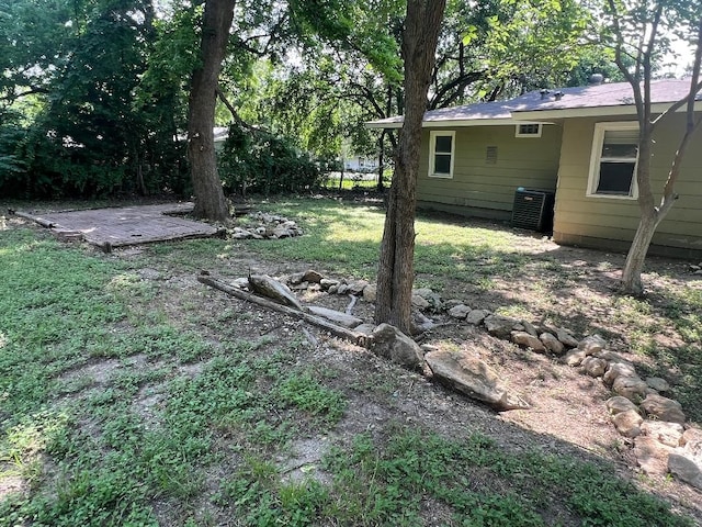 143 Brookshire Ave, Azle, TX 76020 - view of grassy yard featuring central air condition unit