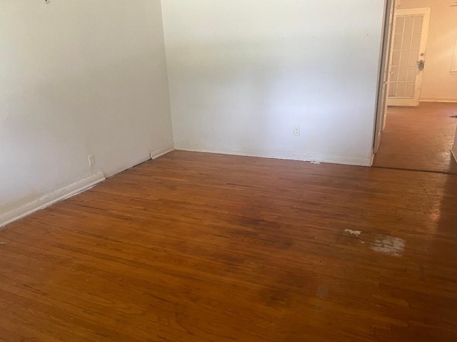 143 Brookshire Ave, Azle, TX 76020 - spare room featuring wood finished floors and baseboards