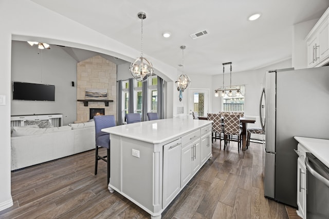 316 Cunningham Cir, Celina, TX 75009 - kitchen featuring a chandelier, stainless steel appliances, plenty of natural light, white cabinets, and recessed lighting
