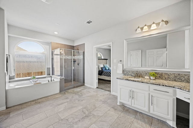 316 Cunningham Cir, Celina, TX 75009 - full bathroom featuring vanity, a bath, a shower stall, ensuite bath, and baseboards