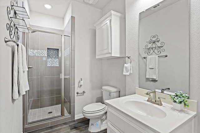 316 Cunningham Cir, Celina, TX 75009 - bathroom with wood finished floors, vanity, toilet, and a stall shower