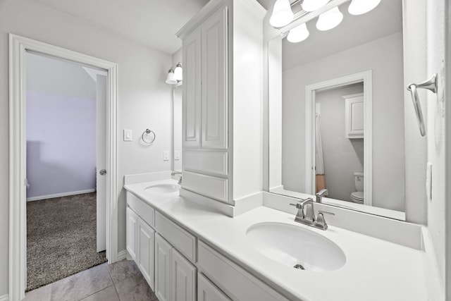 316 Cunningham Cir, Celina, TX 75009 - bathroom with double vanity, toilet, and tile patterned floors
