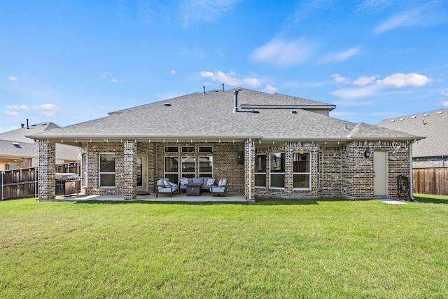 316 Cunningham Cir, Celina, TX 75009 - back of property with a shingled roof, brick siding, a patio area, and an outdoor living space
