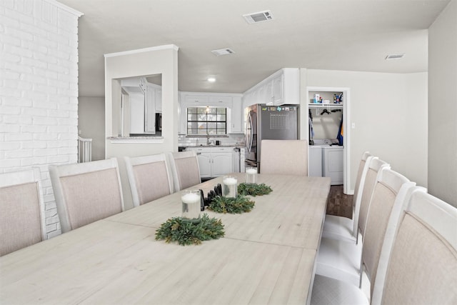 13340 Willow Springs Rd, Haslet, TX 76052 - dining space featuring separate washer and dryer and wood finished floors