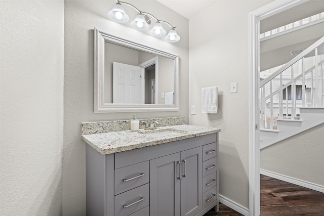 13340 Willow Springs Rd, Haslet, TX 76052 - bathroom with wood finished floors, vanity, and baseboards