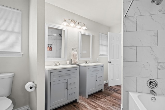 13340 Willow Springs Rd, Haslet, TX 76052 - bathroom with vanity, toilet, wood finished floors, and bathing tub / shower combination