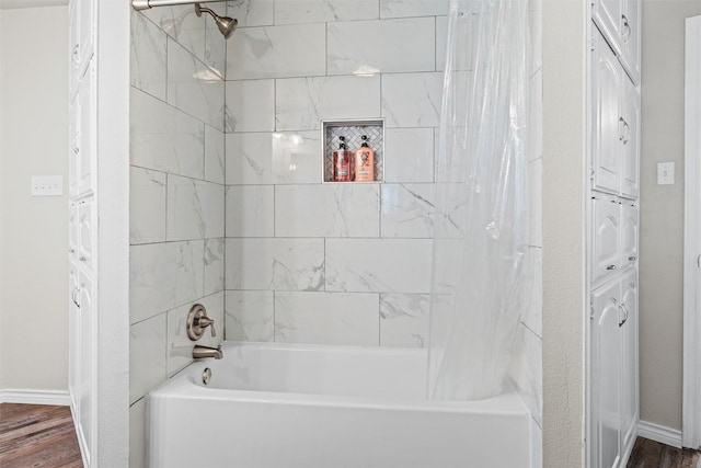 13340 Willow Springs Rd, Haslet, TX 76052 - bathroom with shower / tub combo, wood finished floors, and baseboards