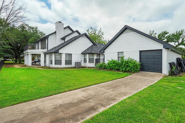 13340 Willow Springs Rd, Haslet, TX 76052 - back of house with concrete driveway, brick siding, a chimney, a yard, and central AC unit