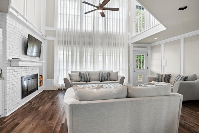 13340 Willow Springs Rd, Haslet, TX 76052 - living area featuring a high ceiling, ceiling fan, a fireplace, and dark wood-type flooring