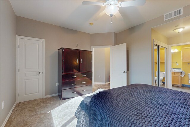 330 Las Colinas Blvd E Unit 920, Irving, TX 75039 - bedroom featuring light carpet, baseboards, ensuite bathroom, and ceiling fan