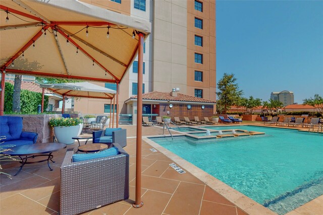 330 Las Colinas Blvd E Unit 920, Irving, TX 75039 - view of swimming pool with a pool with connected hot tub, a patio, and a gazebo