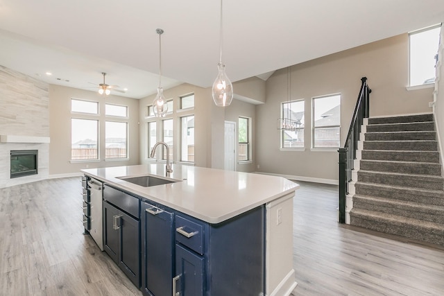 2033 Barbette St, Fort Worth, TX 76008 - kitchen with a sink, open floor plan, light wood-style flooring, ceiling fan, and healthy amount of natural light