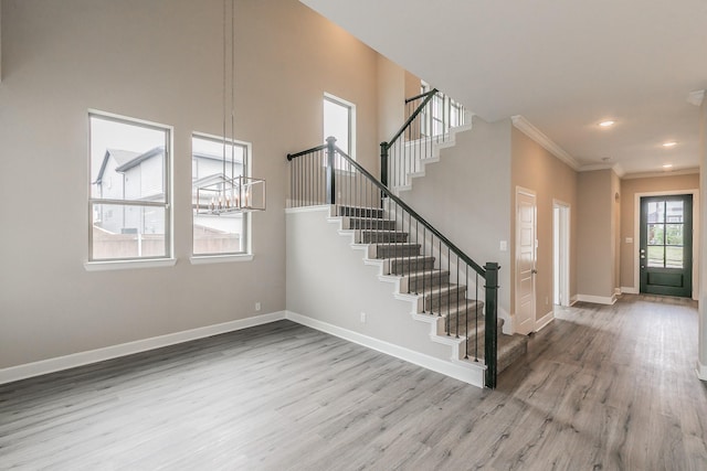 2033 Barbette St, Fort Worth, TX 76008 - foyer entrance with wood finished floors, stairs, baseboards, crown molding, and recessed lighting