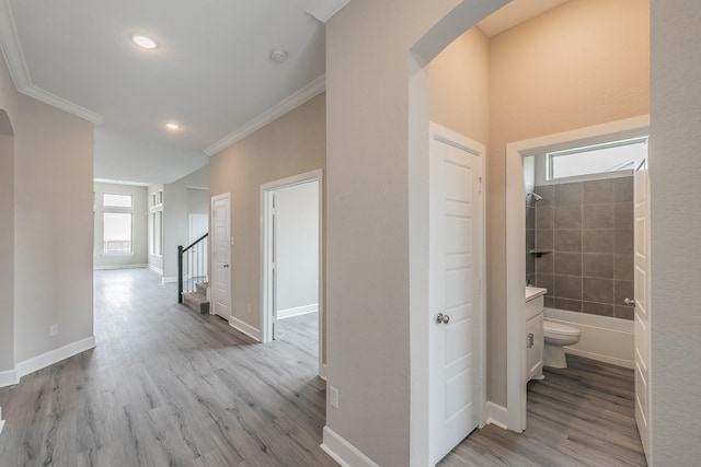 2033 Barbette St, Fort Worth, TX 76008 - corridor with arched walkways, ornamental molding, wood finished floors, baseboards, and recessed lighting