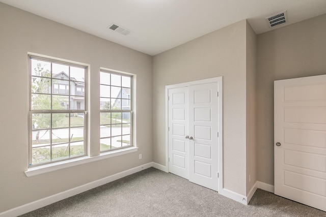 2033 Barbette St, Fort Worth, TX 76008 - unfurnished bedroom featuring multiple windows, carpet floors, and baseboards