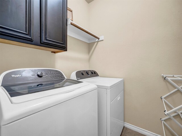 5605 Cojimar Dr, Mckinney, TX 75070 - laundry room featuring washer and clothes dryer, cabinet space, and baseboards