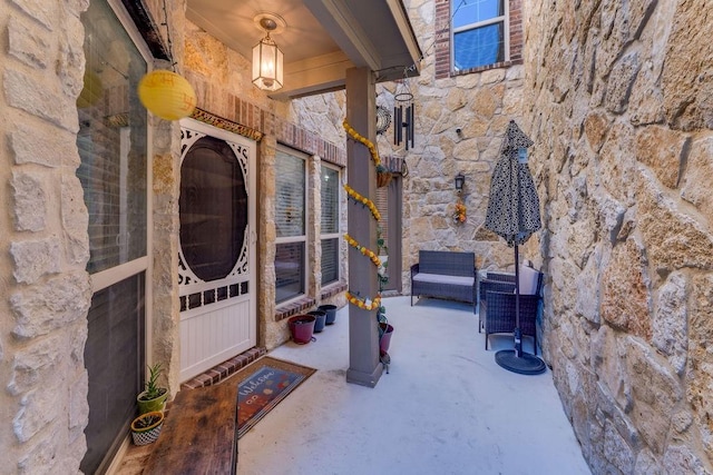 5605 Cojimar Dr, Mckinney, TX 75070 - view of exterior entry with stone siding and a patio