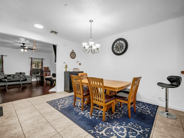 5605 Cojimar Dr, Mckinney, TX 75070 - tiled dining space featuring a chandelier, a ceiling fan, and baseboards