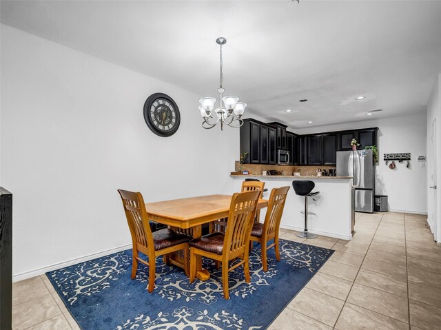 5605 Cojimar Dr, Mckinney, TX 75070 - dining space featuring light tile patterned floors, a chandelier, and recessed lighting