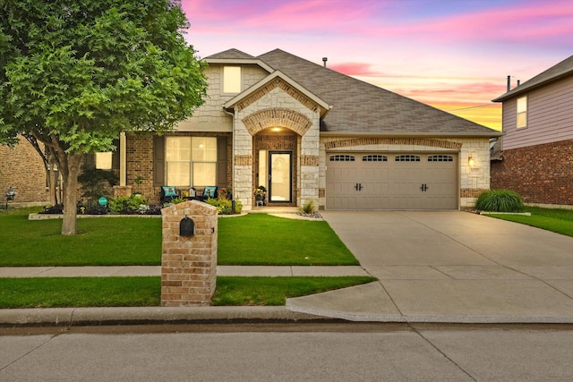 11521 Misty Mesa Dr, Fort Worth, TX 76052 - view of front facade with a lawn, an attached garage, driveway, and brick siding