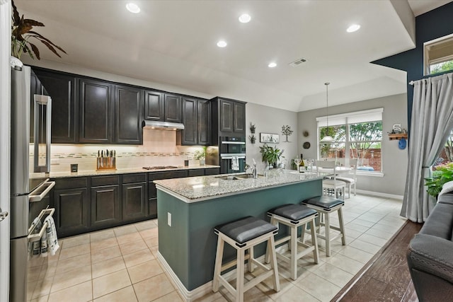11521 Misty Mesa Dr, Fort Worth, TX 76052 - kitchen with appliances with stainless steel finishes, recessed lighting, under cabinet range hood, healthy amount of natural light, and tasteful backsplash