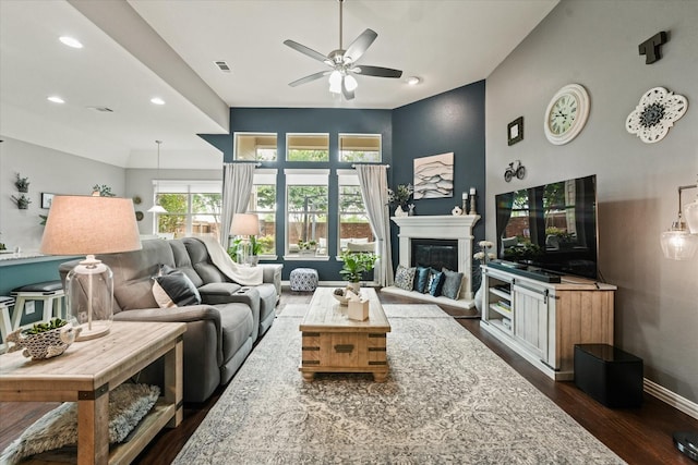 11521 Misty Mesa Dr, Fort Worth, TX 76052 - living area featuring ceiling fan, dark wood-style floors, a glass covered fireplace, baseboards, and recessed lighting
