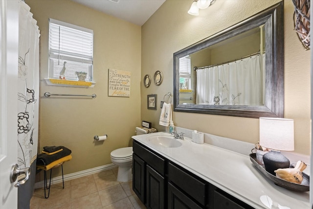 11521 Misty Mesa Dr, Fort Worth, TX 76052 - full bath with healthy amount of natural light, toilet, vanity, and tile patterned floors