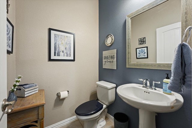 11521 Misty Mesa Dr, Fort Worth, TX 76052 - half bathroom featuring toilet, baseboards, and tile patterned flooring