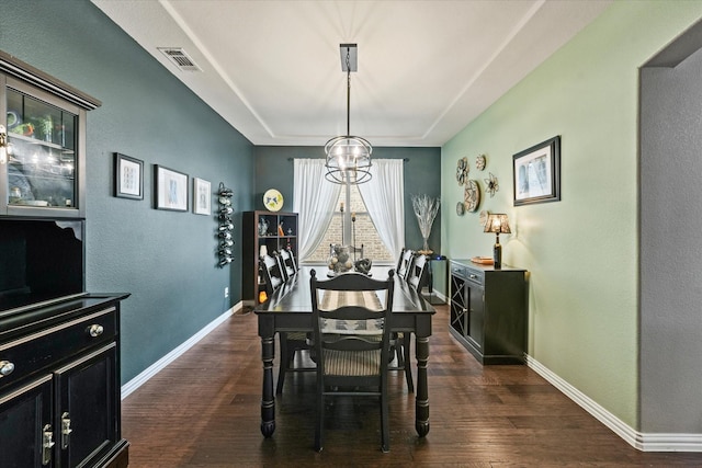 11521 Misty Mesa Dr, Fort Worth, TX 76052 - dining room featuring dark wood-style floors, baseboards, a tray ceiling, and a chandelier