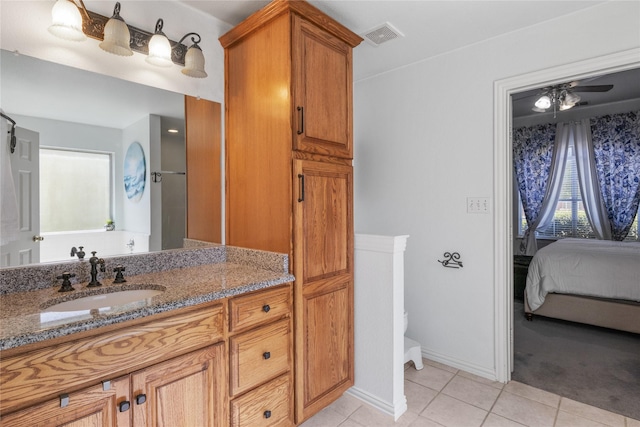 4425 Maple Shade Ave, Sachse, TX 75048 - ensuite bathroom featuring tile patterned flooring, vanity, and toilet