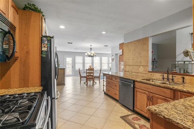 4425 Maple Shade Ave, Sachse, TX 75048 - kitchen with dishwashing machine, a sink, black microwave, brown cabinetry, and a chandelier
