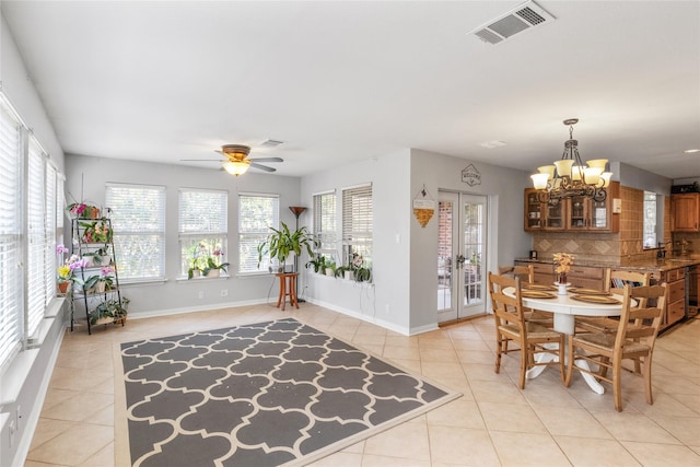 4425 Maple Shade Ave, Sachse, TX 75048 - dining space featuring light tile patterned floors, a chandelier, ceiling fan, and baseboards