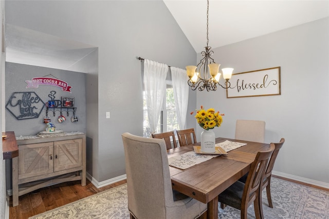 4425 Maple Shade Ave, Sachse, TX 75048 - dining room featuring wood finished floors, a chandelier, baseboards, and lofted ceiling