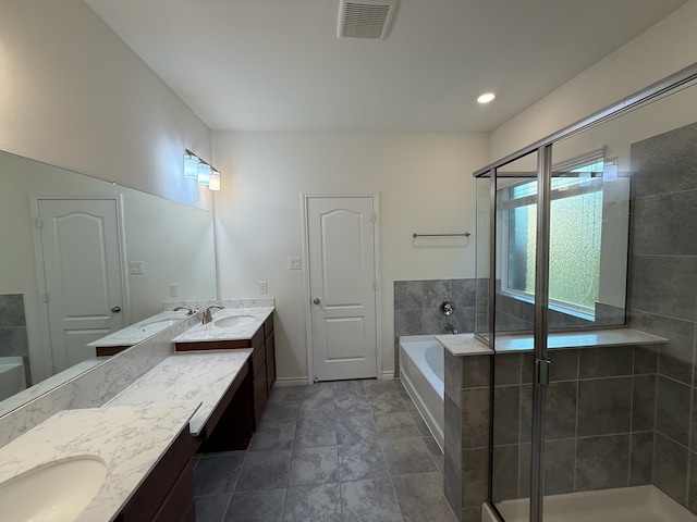 3681 Keechi Creek Dr, Celina, TX 75078 - bathroom featuring double vanity, a bath, a shower stall, and baseboards