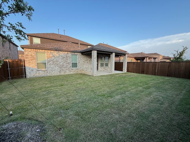 3681 Keechi Creek Dr, Celina, TX 75078 - back of property with a patio area, a shingled roof, and brick siding