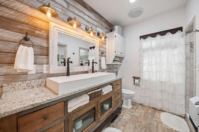 720 Aqua Vista Dr, Granbury, TX 76049 - bathroom featuring vanity, toilet, and wood finished floors