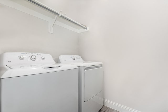 8409 Alba Ln, Rowlett, TX 75089 - laundry area with washer and dryer and baseboards