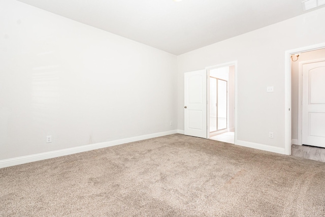 8409 Alba Ln, Rowlett, TX 75089 - spare room featuring light colored carpet and baseboards
