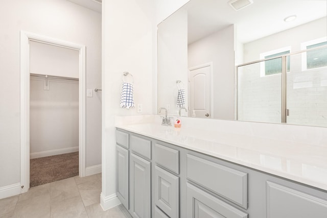 8409 Alba Ln, Rowlett, TX 75089 - full bath with a shower stall, a spacious closet, vanity, and baseboards