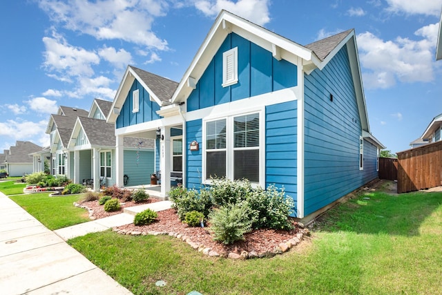 8409 Alba Ln, Rowlett, TX 75089 - view of front of home with board and batten siding and roof with shingles
