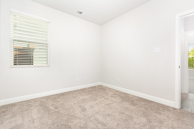 8409 Alba Ln, Rowlett, TX 75089 - unfurnished room featuring light carpet and baseboards
