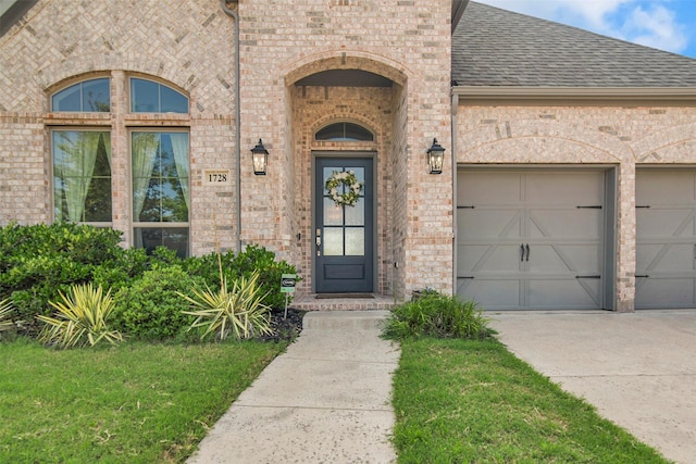1728 Cannon St, Van Alstyne, TX 75495 - french country home with brick siding, an attached garage, concrete driveway, roof with shingles, and a front yard