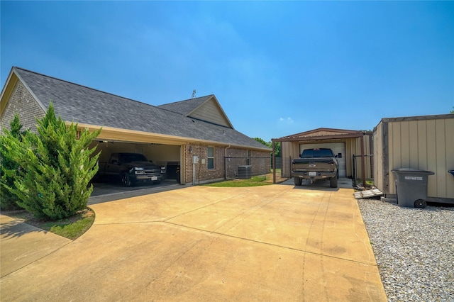 144 Brady Coleman Ln, Springtown, TX 76082 - view of home's exterior with brick siding, central AC, roof with shingles, concrete driveway, and a garage