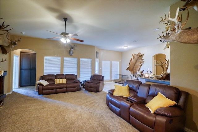 144 Brady Coleman Ln, Springtown, TX 76082 - living area featuring arched walkways, carpet flooring, and ceiling fan