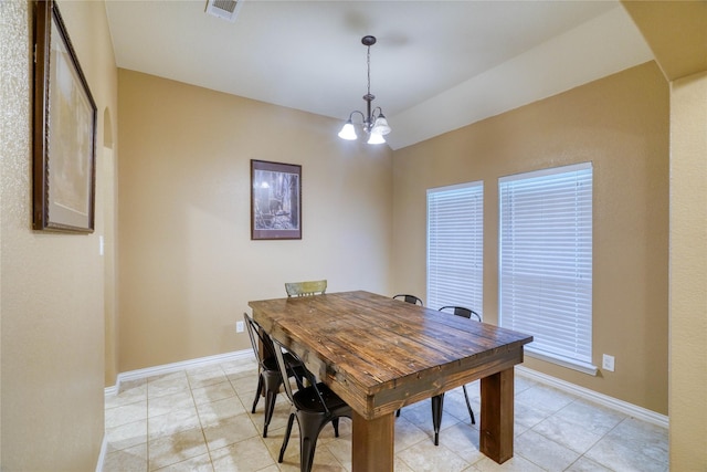 144 Brady Coleman Ln, Springtown, TX 76082 - dining room featuring a chandelier, light tile patterned flooring, and baseboards