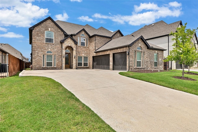 566 Long Meadow Dr, Haslet, TX 76052 - french country style house with an attached garage, brick siding, and concrete driveway