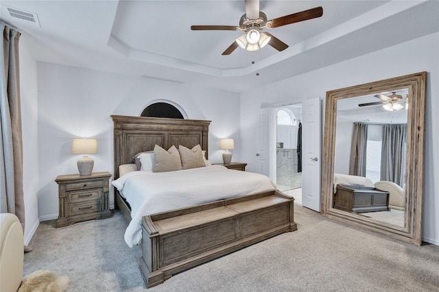 566 Long Meadow Dr, Haslet, TX 76052 - bedroom with light colored carpet, a tray ceiling, ceiling fan, and connected bathroom