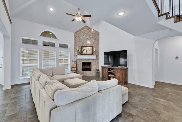 566 Long Meadow Dr, Haslet, TX 76052 - living room featuring high vaulted ceiling, a ceiling fan, arched walkways, a large fireplace, and recessed lighting