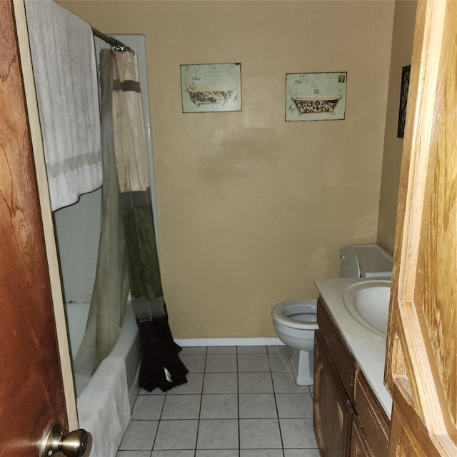 4515 Indian Oaks Trl, Arlington, TX 76017 - bathroom featuring toilet, vanity, tile patterned floors, baseboards, and shower / tub combo